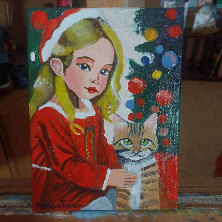 Bambina col cappello di Babbo Natale accanto al gatto e all'albero. Quadro a olio su tela.